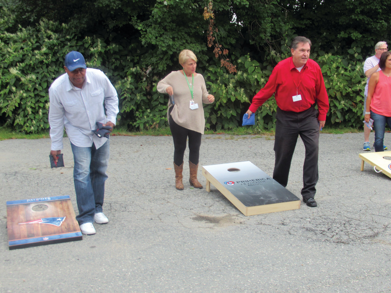 PROLIFIC PLAYERS: This was the scene earlier this month at Cranston-based Gentry Moving & Storage as a Cornhole Elimination Tournament raised $1,400 for the nonprofit TLC4LTC.